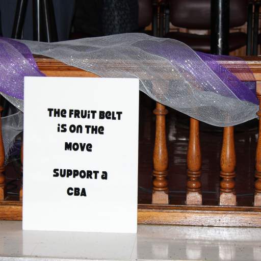 Residents displayed signs calling for broader support of a community benefits agreement to help the Fruit Belt.