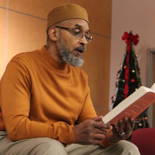 BaBa Eng offers a reading during the Emerging Leaders talent show.