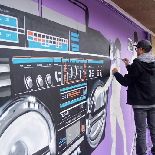 A scene from the Skateland Mural Raising Party.