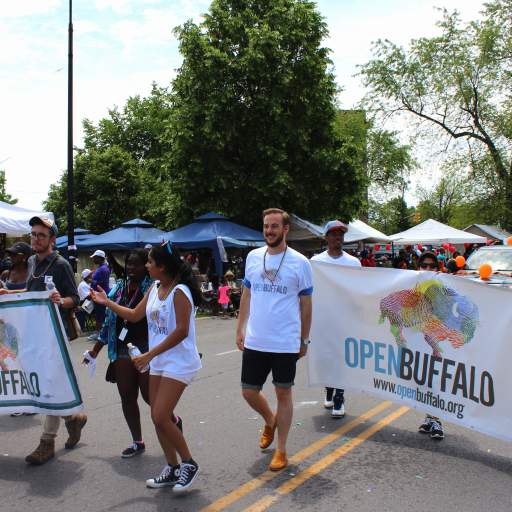 14. Carrying Open Buffalo banners into MLK Park.