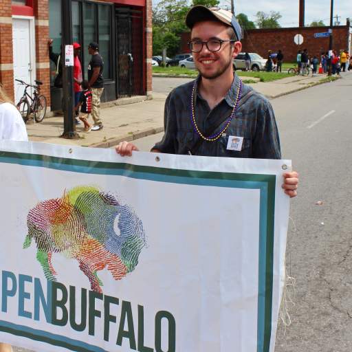 07. Carrying the Open Buffalo banner down Genesee Street.