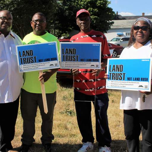 "Land Trust, Not Land Rush!"