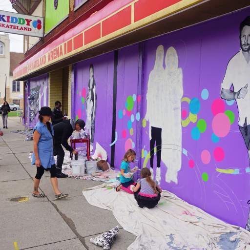 A scene from the Skateland Mural Raising Party.