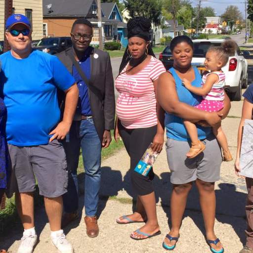 Staff from WGRZ, Channel 2 and Open Buffalo meet with relatives of Jerald "Dee Dee" Goldsmith and glass mosaic artist Megan McElf.