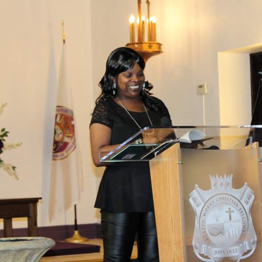 A local poet sets the stage for Nicole Lee's talk on human rights and policing.