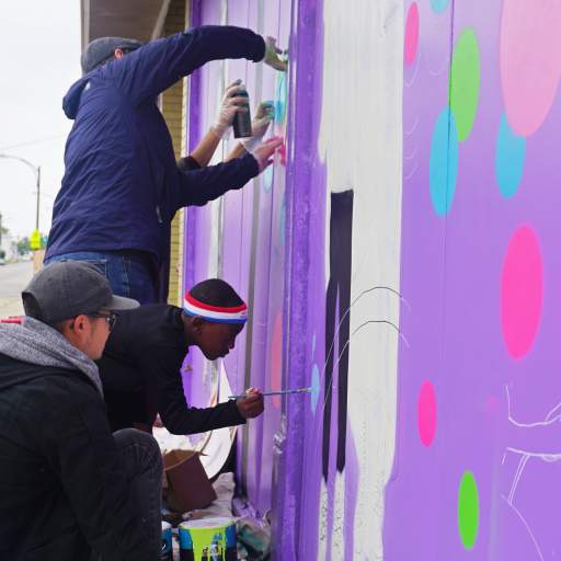 A scene from the Skateland Mural Raising Party.