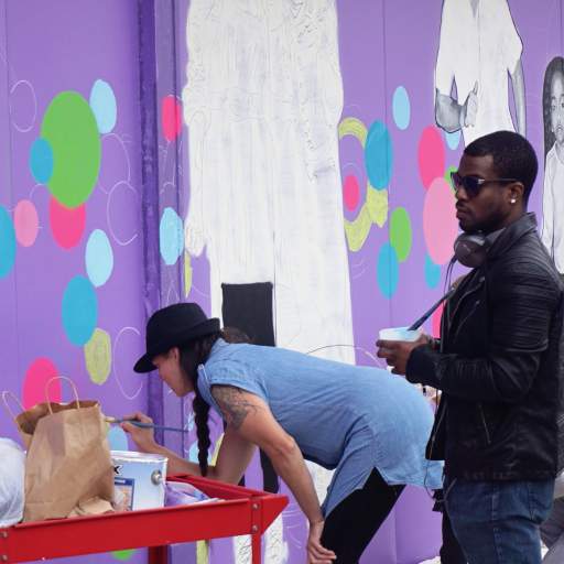 A scene from the Skateland Mural Raising Party.