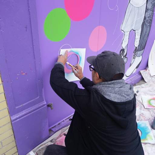A scene from the Skateland Mural Raising Party.