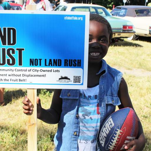 "Land Trust, Not Land Rush!"