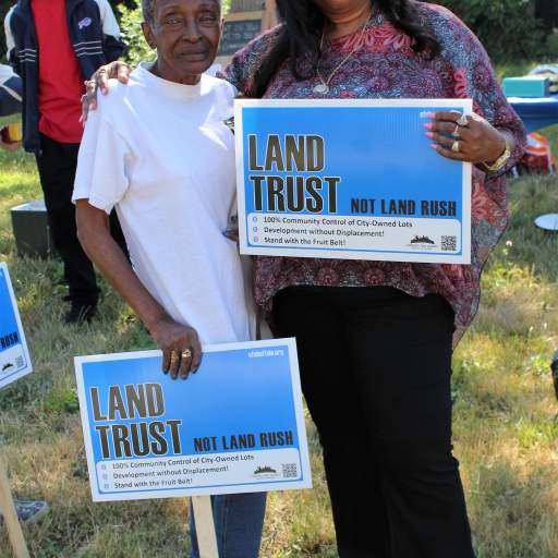 "Land Trust, Not Land Rush!"