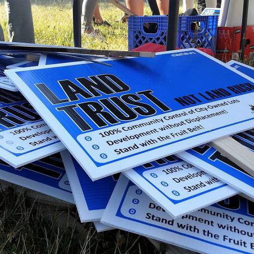 "Land Trust, Not Land Rush!"