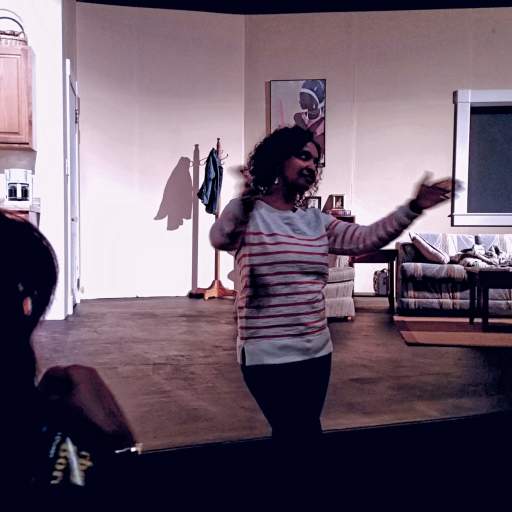 Rahwa Ghirmatzion, Ujima's Executive Director, welcomes the audience.