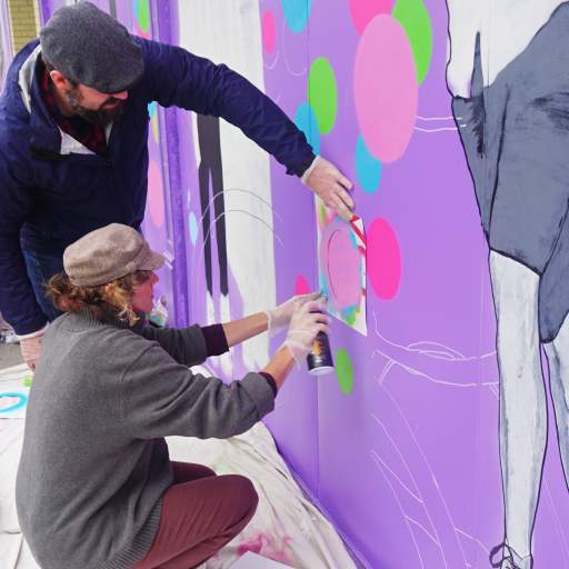A scene from the Skateland Mural Raising Party.