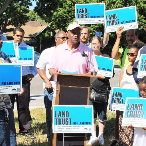 Zaid B. Islam, a Fruit Belt community leader, speaks at the "Land Trust, Not Land Rush" press event.