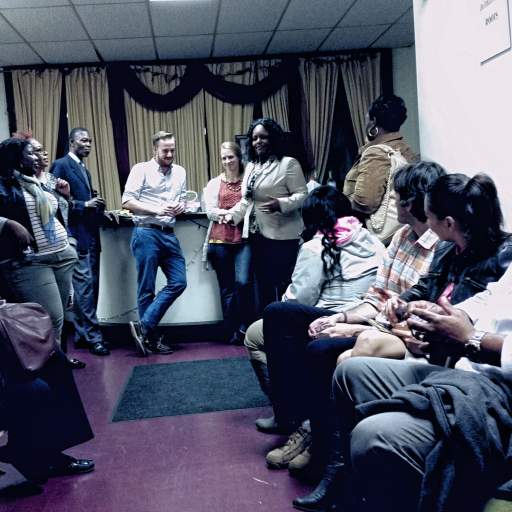 Open Buffalo partners chat during a pre-show reception at Ujima.